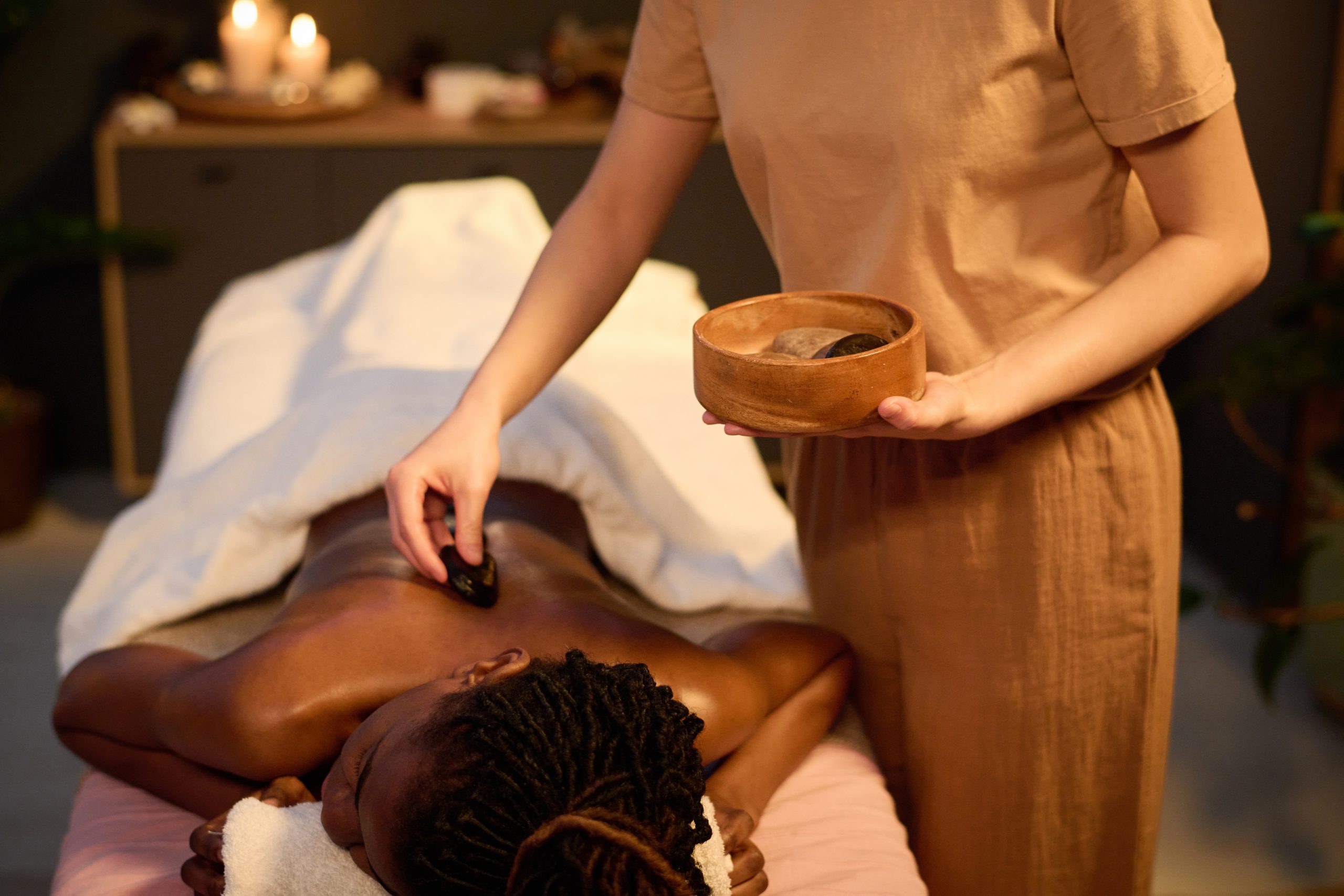 wooden-bowl-full-of-hot-stones-in-female-hand-2025-03-03-14-24-17-utc